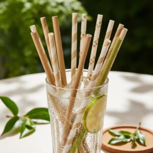 Variety of eco-friendly biodegradable drinking straws in a glass, highlighting sustainable materials